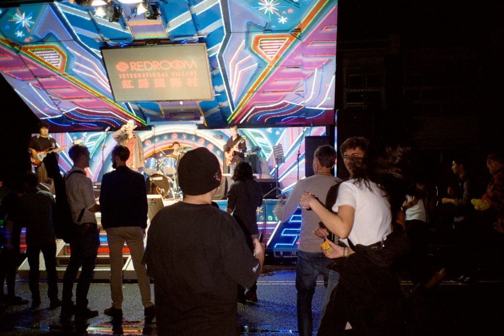 Red Roomers collect in front of the stage for a late night performance