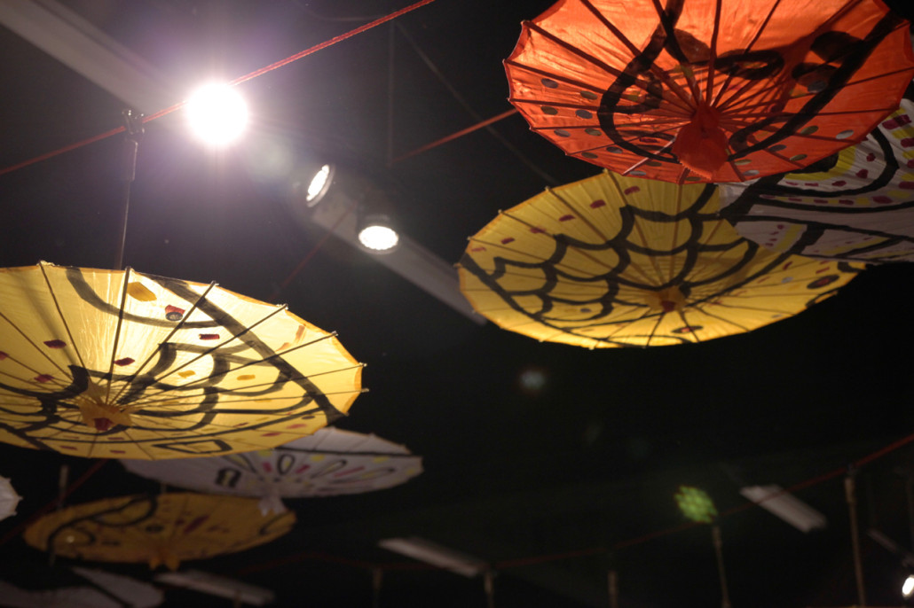 Bara's umbrellas hung festively across the Red Room's ceiling